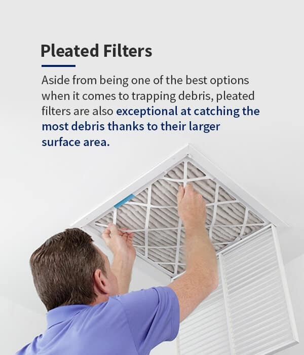 Installation of a pleated air filter, demonstrating the importance of correct sizing and regular maintenance.